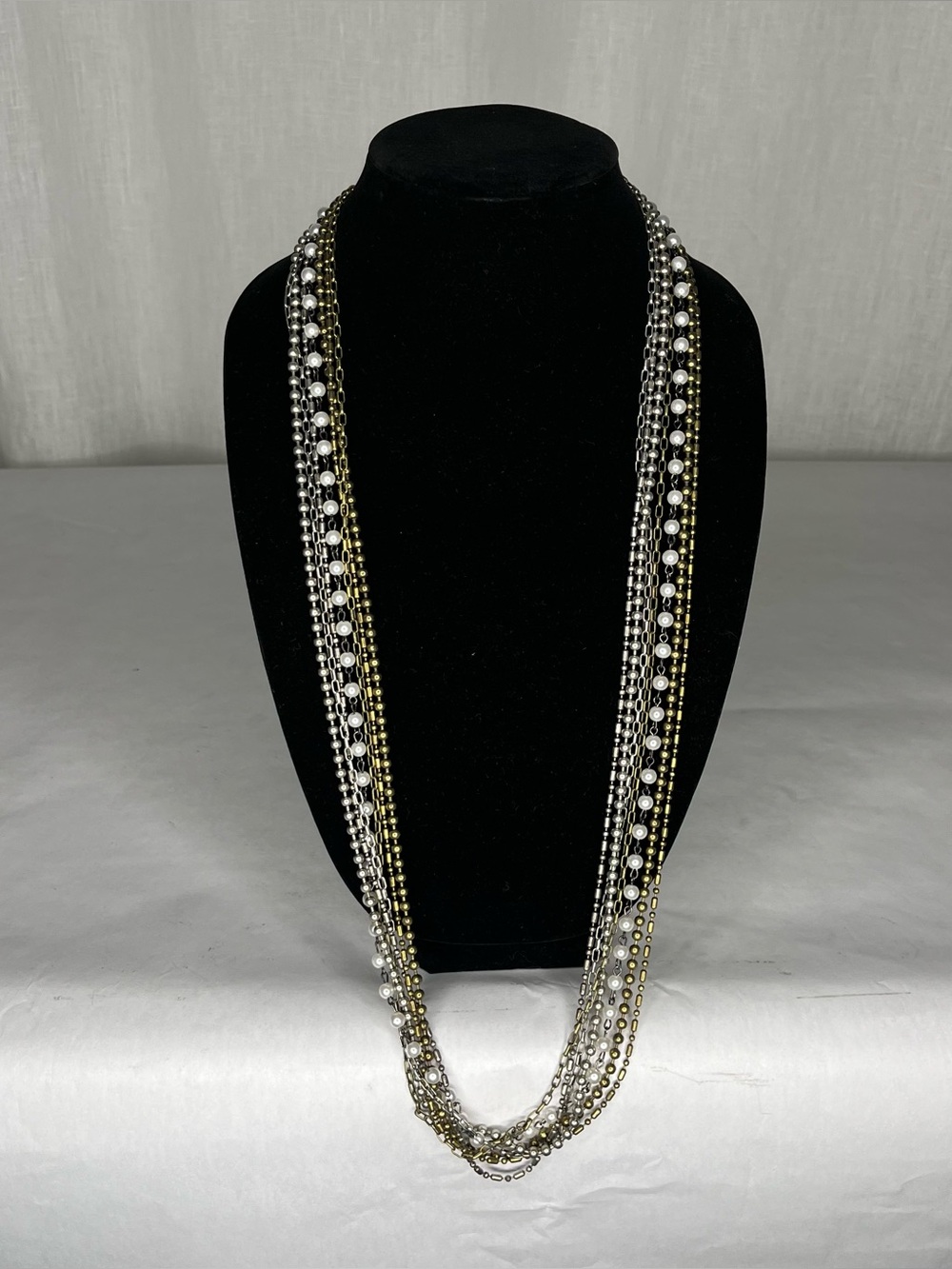 Gold and silver chains with pearls